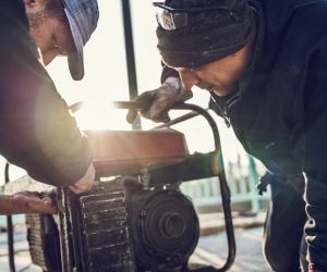 Men using generator machine image
